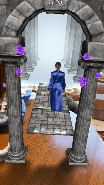 RVNG logo activation: a stone archway rises from the table and a figure walks through it