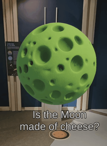 Animated whimsical green cheese Moon floating above a floor marker